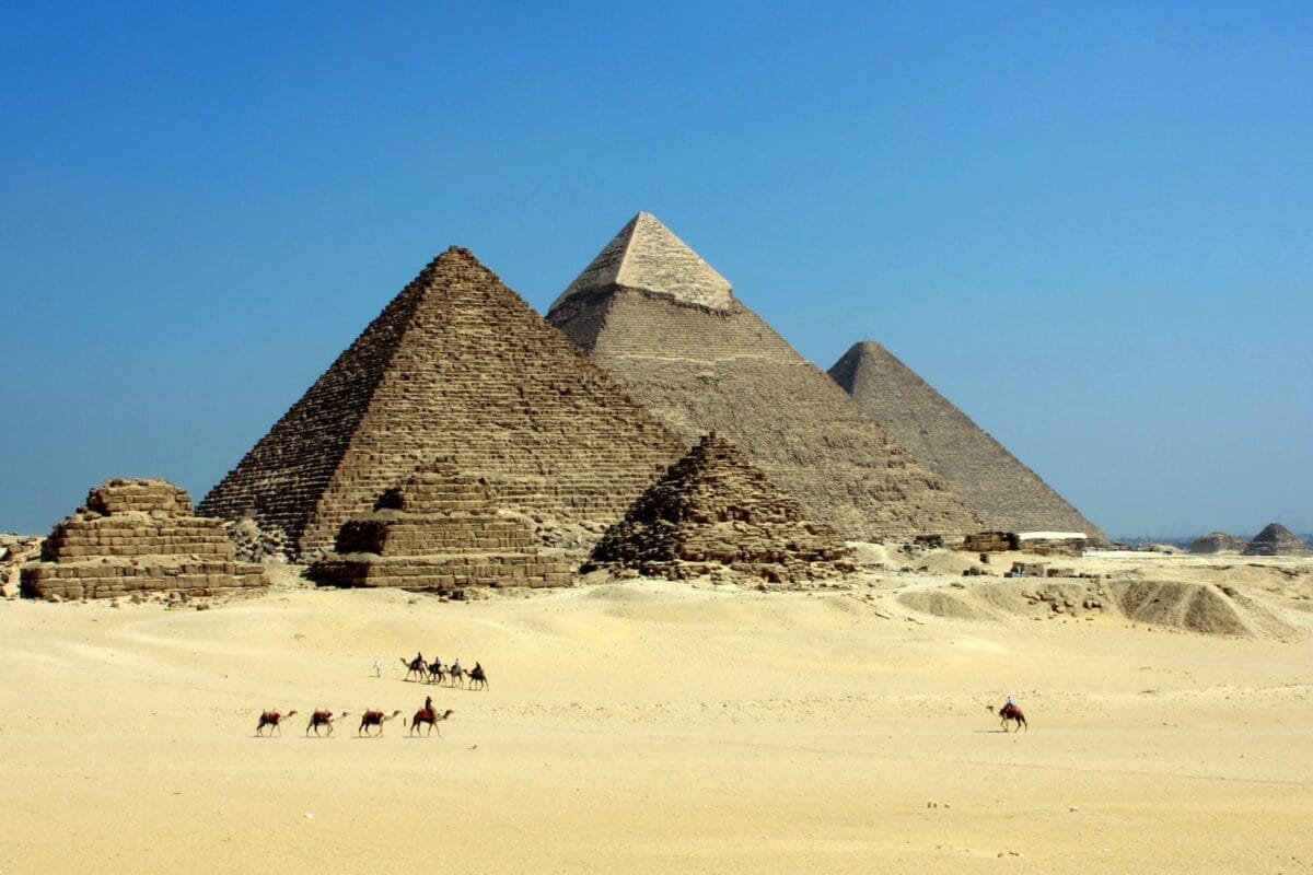 gray pyramid on dessert under blue sky